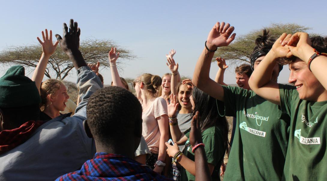 A local community in Tanzania meets up with Projects Abroad volunteers. Projects Abroad volunteers in Tanzania are dancing with the local community they are working with.